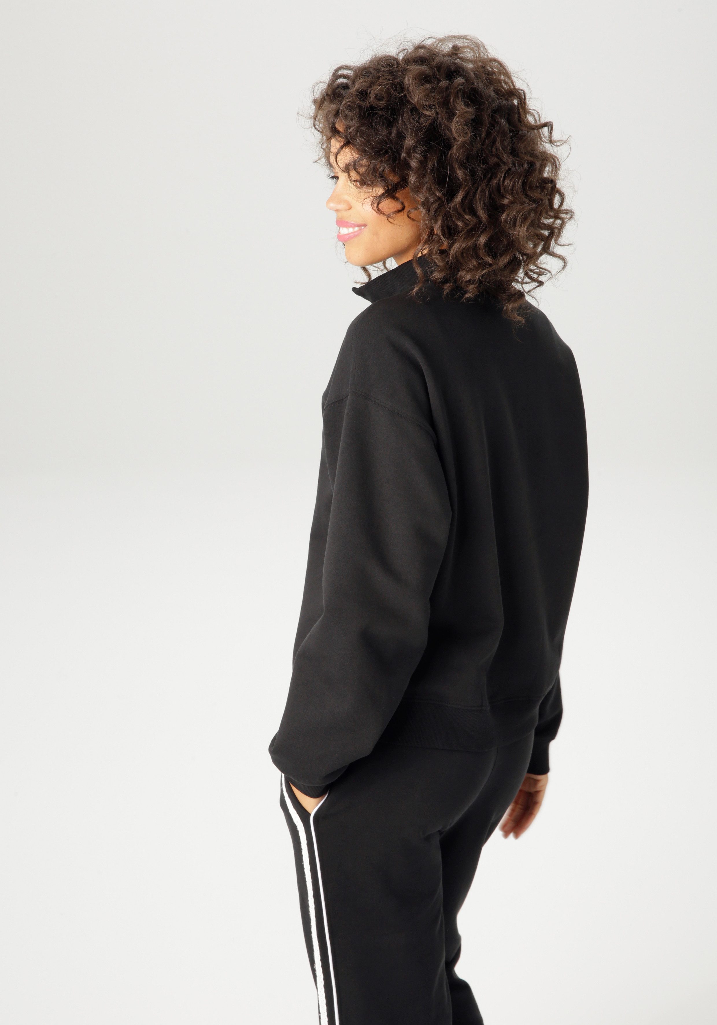 Aniston CASUAL Sweatshirt aufwändig mit Stickerei und Spitzenbändern verzie günstig online kaufen