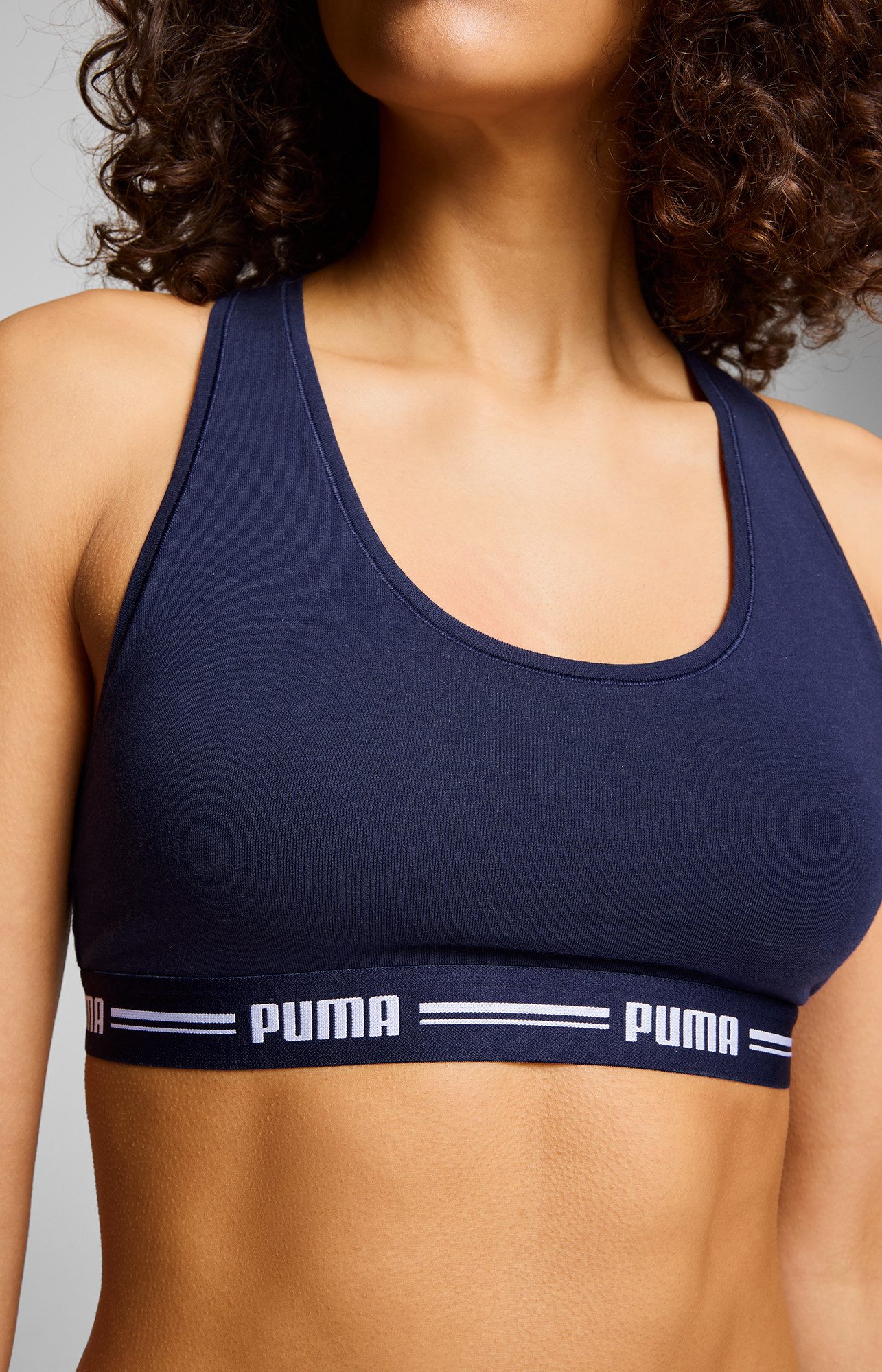 PUMA Sport-Bustier PUMA WOMEN RACER BACK TOP 1P HANG Racerback-Rücken, Logo-Unterbrustband, ohne Bügel, elastisch