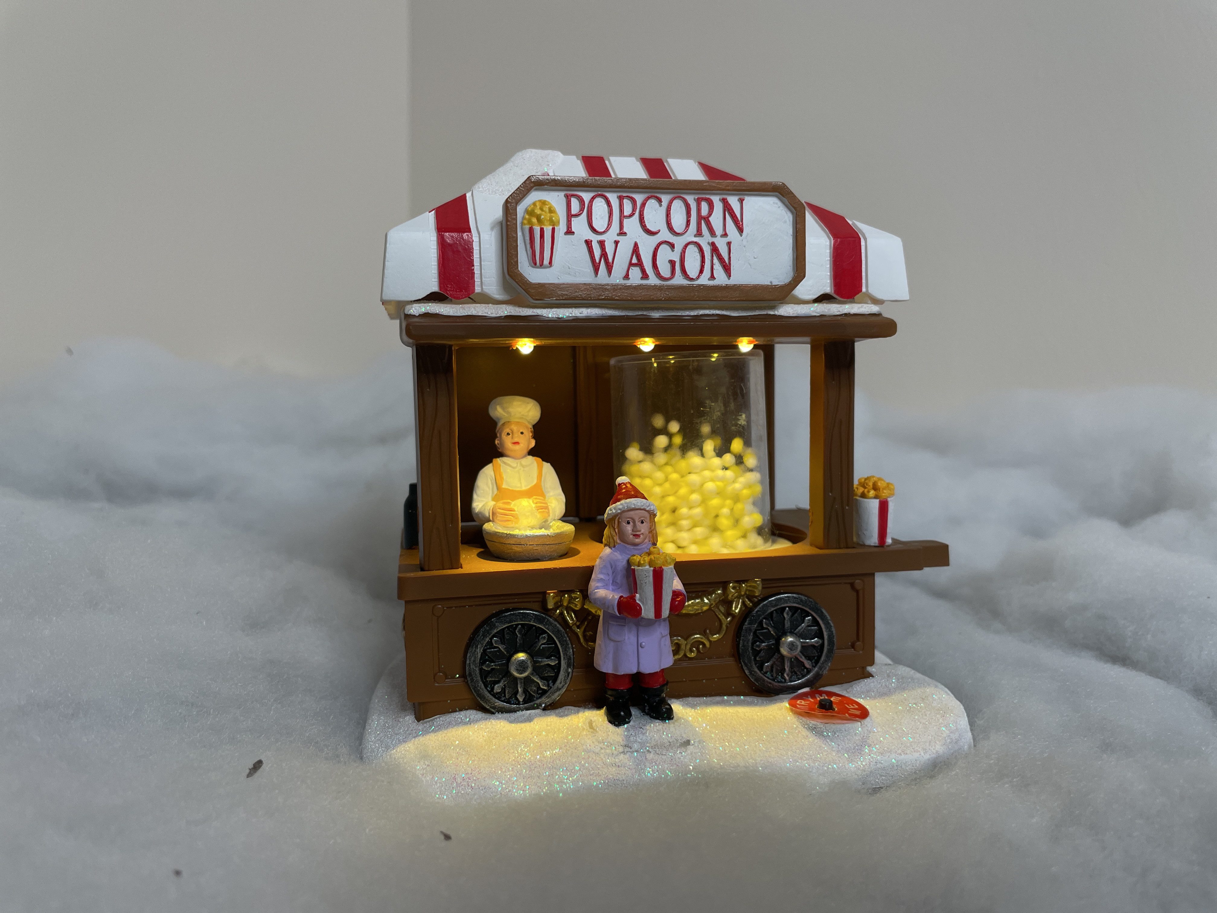 Dekofigur Weihnachtsdorf: Popcornautomat mit LED, bewegenden Popcorns