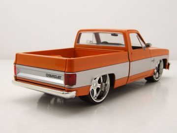 JADA Modellauto Chevrolet C-10 Pick Up 1985 orange grau Modellauto 1:24 Jada Toys, Maßstab 1:24