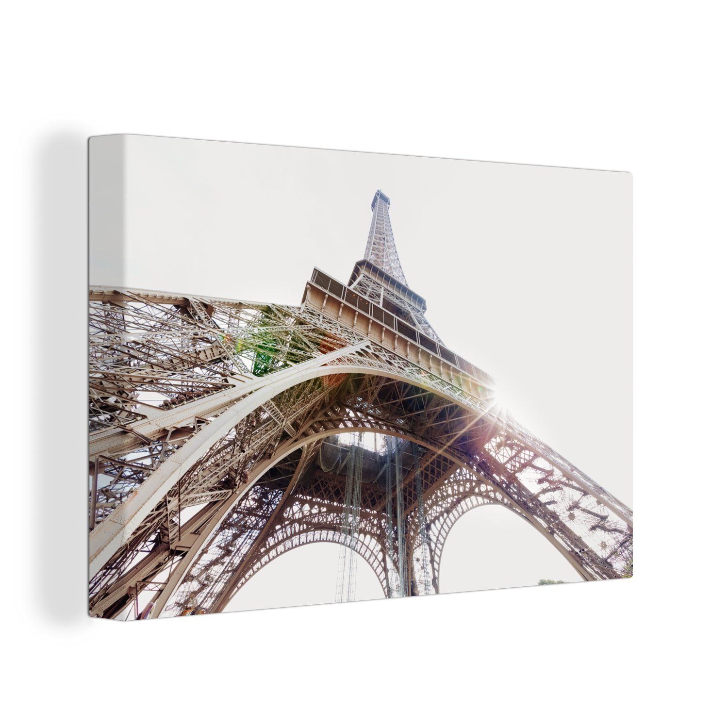 OneMillionCanvasses® Leinwandbild Der Eiffelturm mit einem Sonnenstrahl durch den Eisenrahmen, (1 St), Wandbild Leinwandbilder, Aufhängefertig, Wanddeko, 30x20 cm