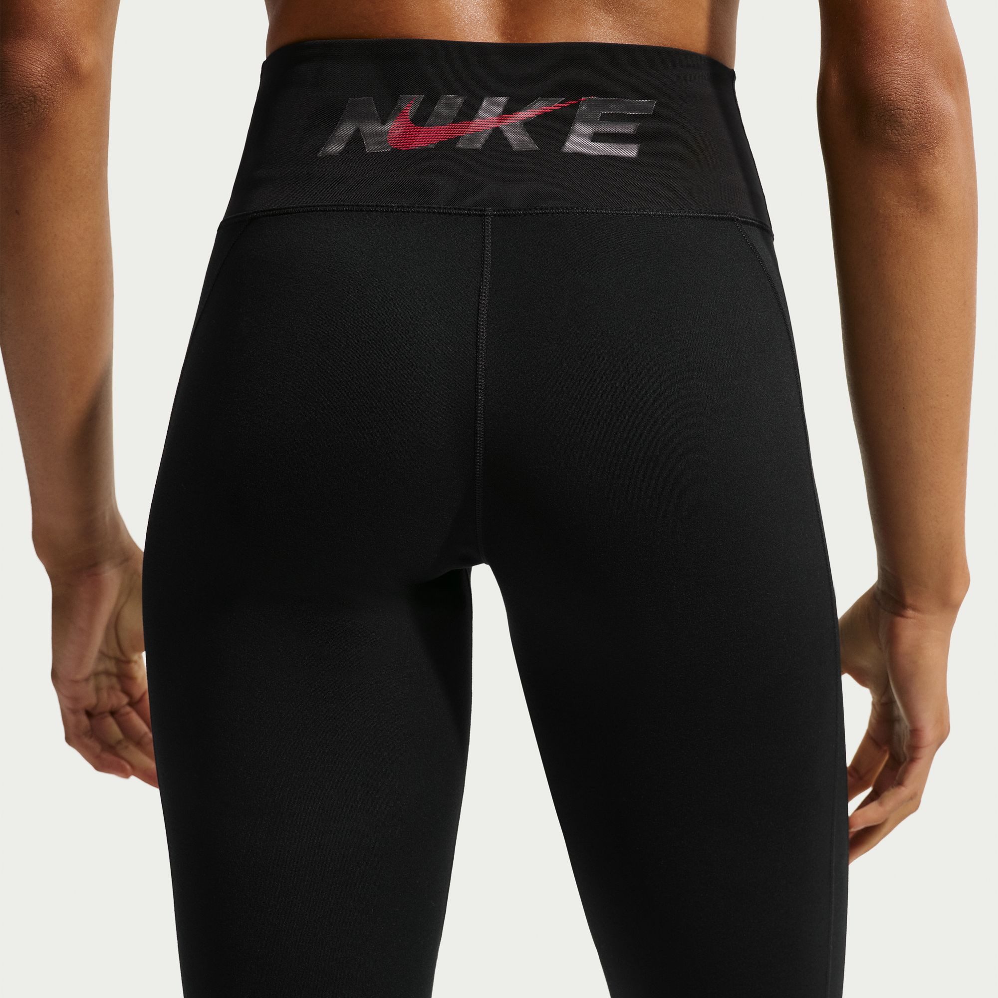 Nike Trainingstights W NK DF ONE TIGHT CPSL B für Fitness und Streetwear, schwarze Grundfarbe