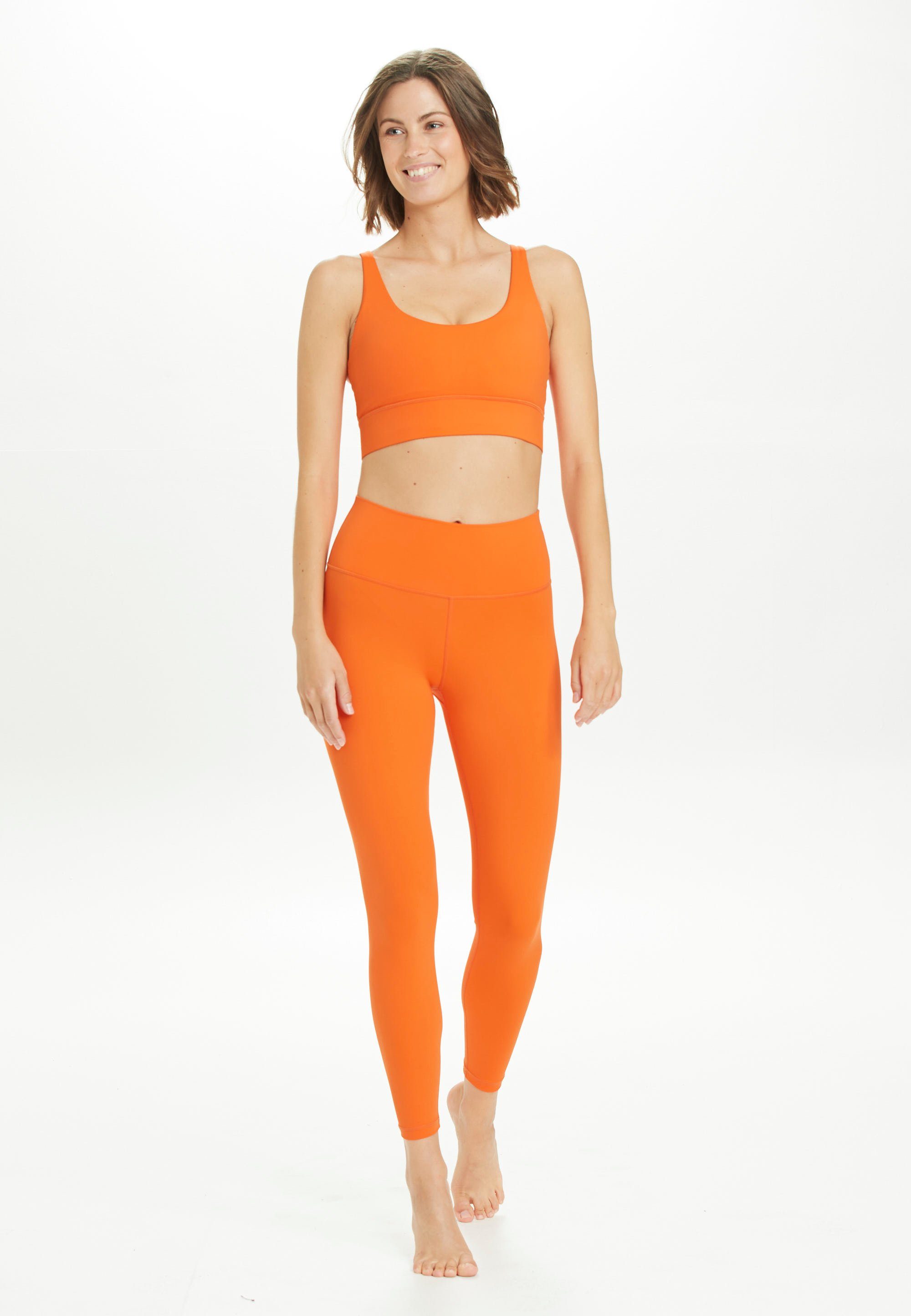 ATHLECIA Trainingstights Gaby mit orange Dehnbund bequemem