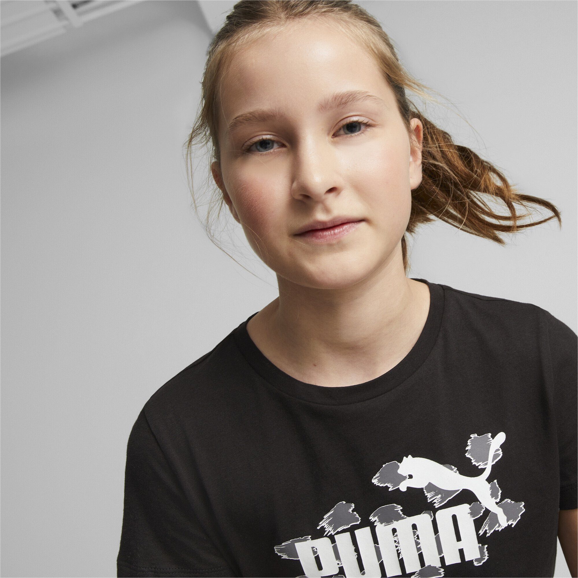 PUMA T-Shirt Essentials+ Black ANIMAL Jugendliche T-Shirt