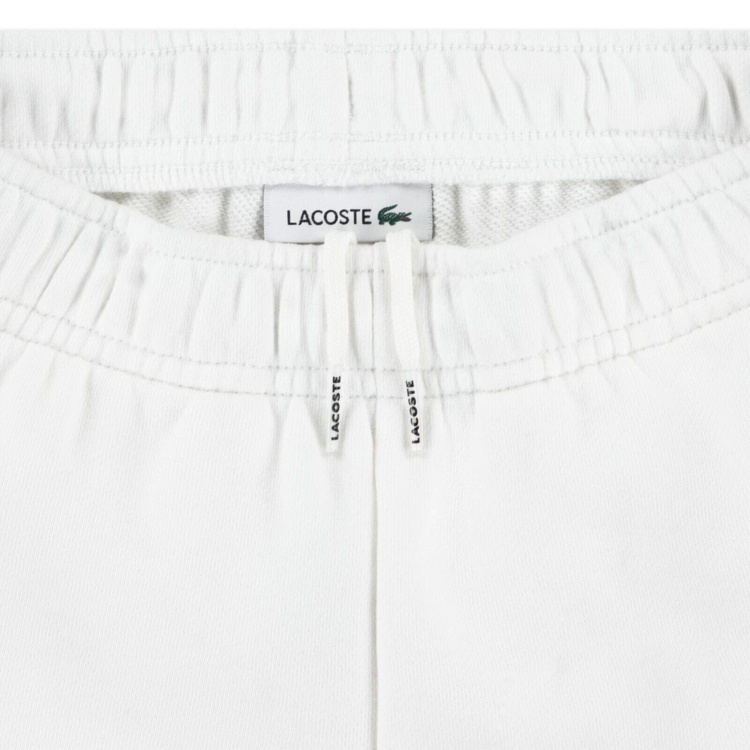 Lacoste Shorts Lacoste Kinder Shorts mit Logo-Seitenstreifen in Weiß