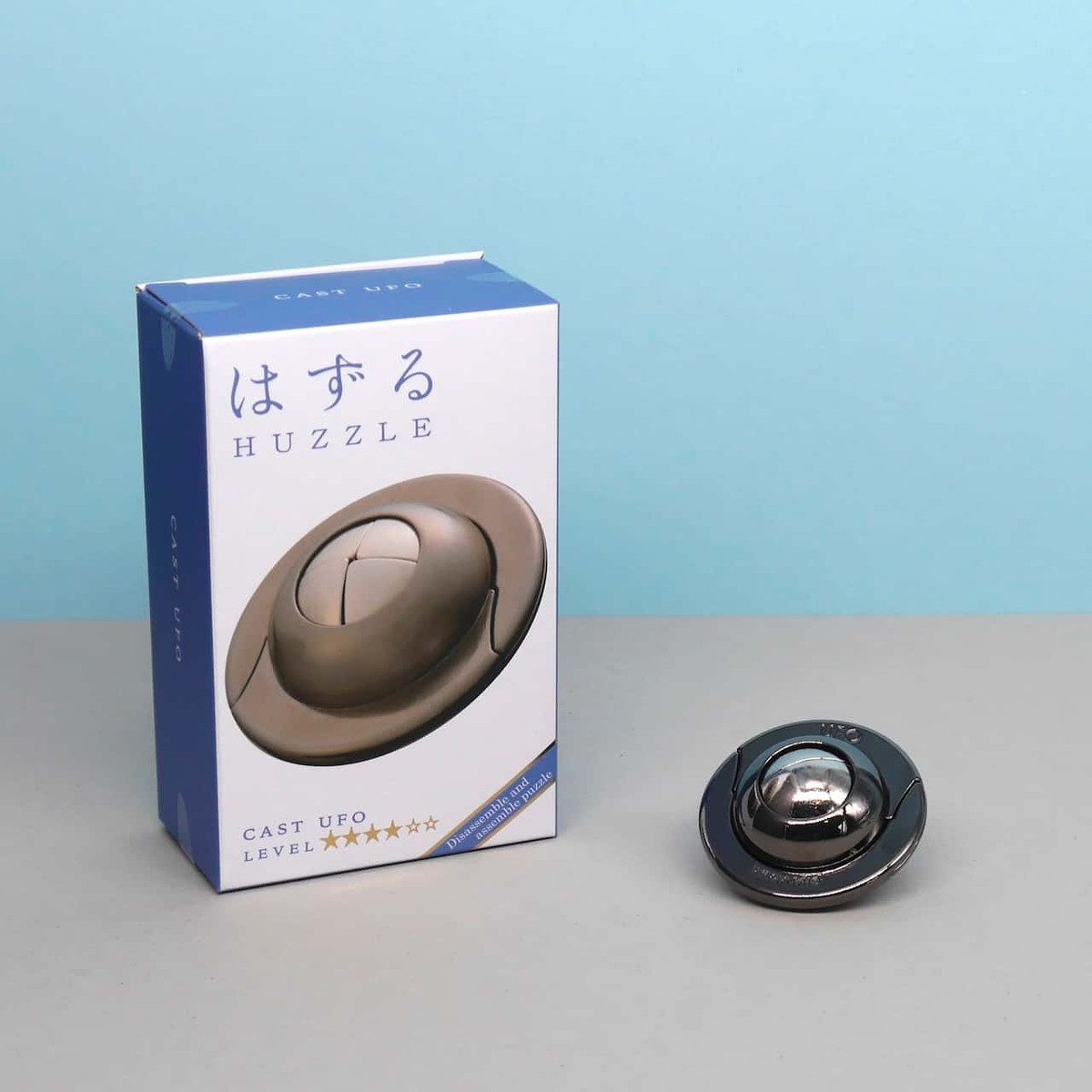 Hanayama Spiel HUZZLE CAST UFO - rätselhaftes Geduldspiel, Knobelspiel, Metallpuzzle