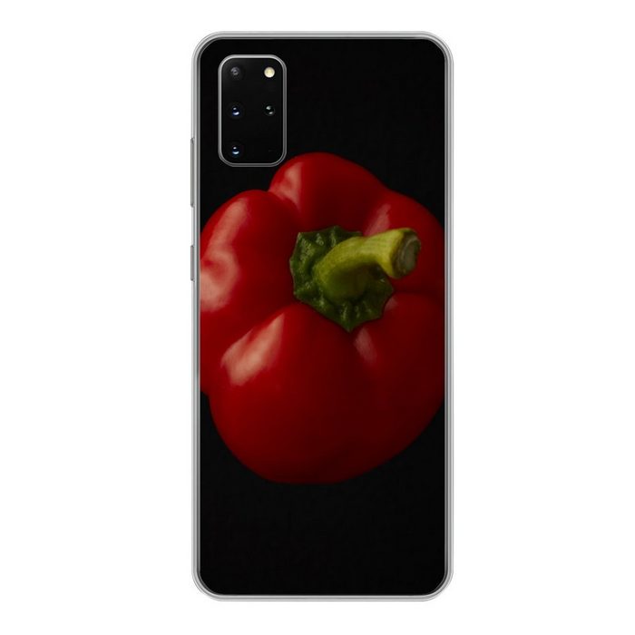 MuchoWow Handyhülle Eine rote Paprika auf schwarzem Hintergrund Phone Case Handyhülle Samsung Galaxy S20 Plus Silikon Schutzhülle