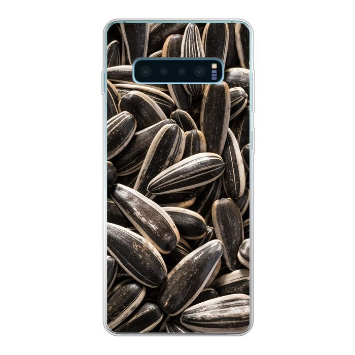 MuchoWow Handyhülle Nahaufnahme von schwarzen Sonnenblumenkernen Phone Case Handyhülle Samsung Galaxy S10+ Silikon Schutzhülle