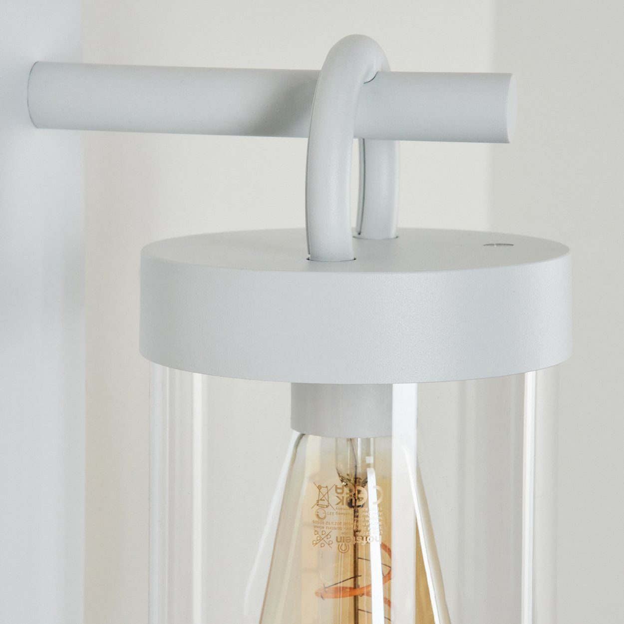 hofstein Außen-Wandleuchte moderne Wandlampe aus Metall/Kunststoff in Weiß/Klar, ohne Leuchtmittel, mit Dämmerungssensor und An-/Ausschalter, 1x E27, IP44