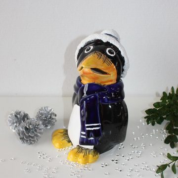 Tangoo Gartenfigur Tangoo Keramik-Pinguin mit blauem Schal und Mütze, (Stück)