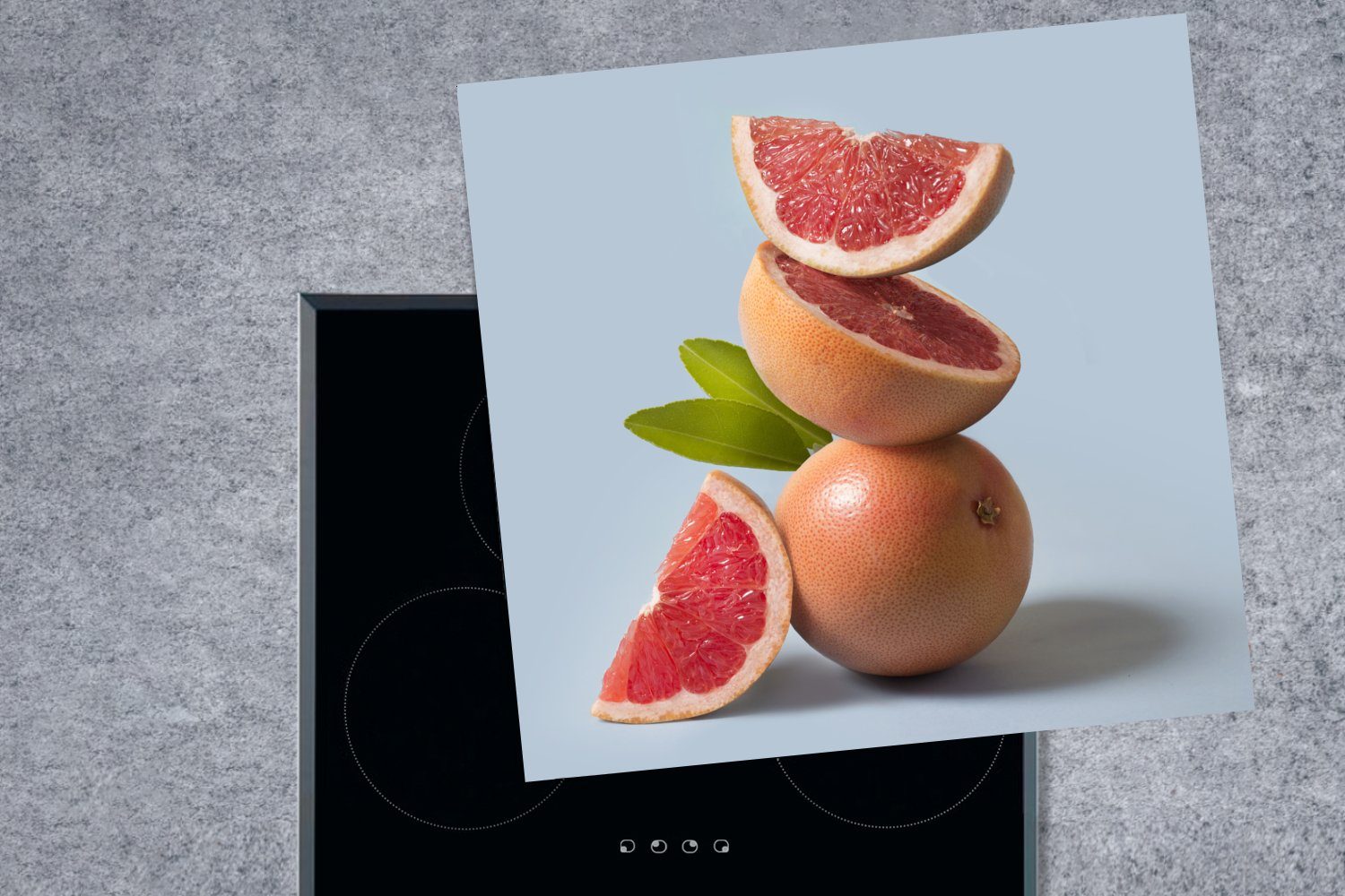 MuchoWow Herdblende-/Abdeckplatte Frische Grapefruit (1 Vinyl, Arbeitsplatte cm, 78x78 tlg), gestapelt gegen Hintergrund, Ceranfeldabdeckung, küche für hellblauen