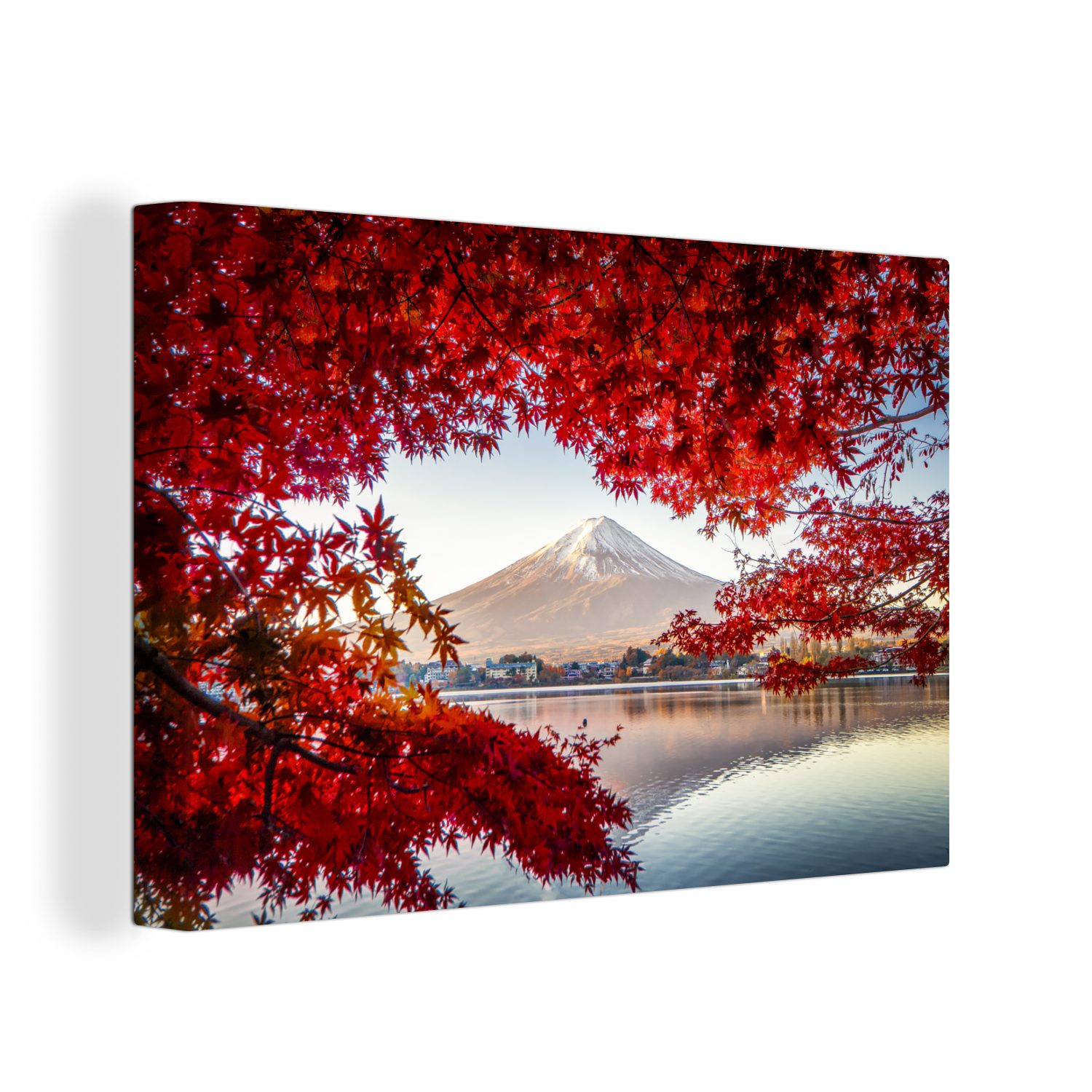 Leinwandbild Der Berg Fuji durch rote Blätter in Japan gesehen
