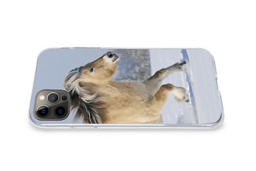 MuchoWow Handyhülle Fjordpferd läuft durch den Schnee, Handyhülle Apple iPhone 12 Pro Max, Smartphone-Bumper, Print, Handy