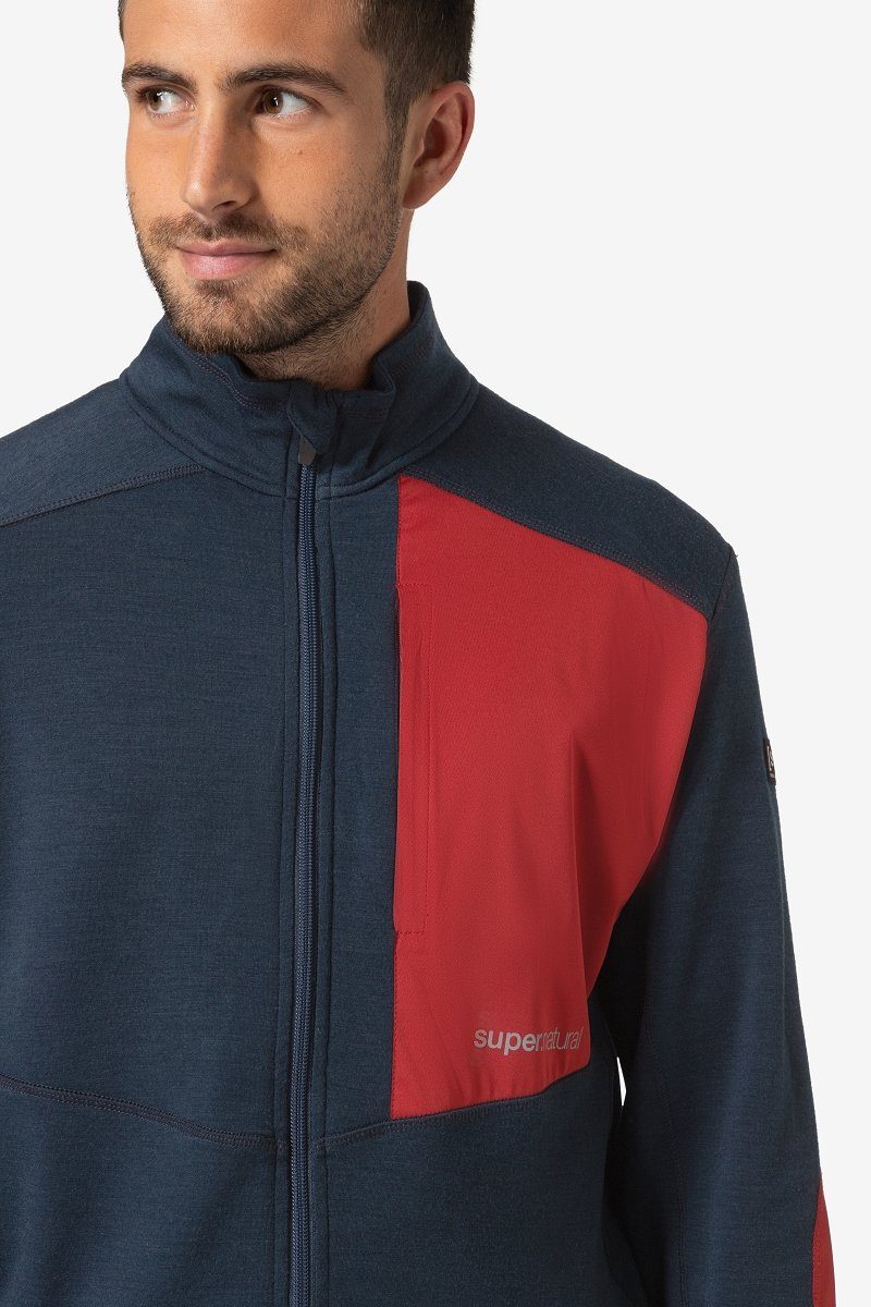 SUPER.NATURAL M Merino-Materialmix ADVENTURE TRACK Merino Blueberry/Sun Dried Outdoorjacke funktioneller Tomato Jacke