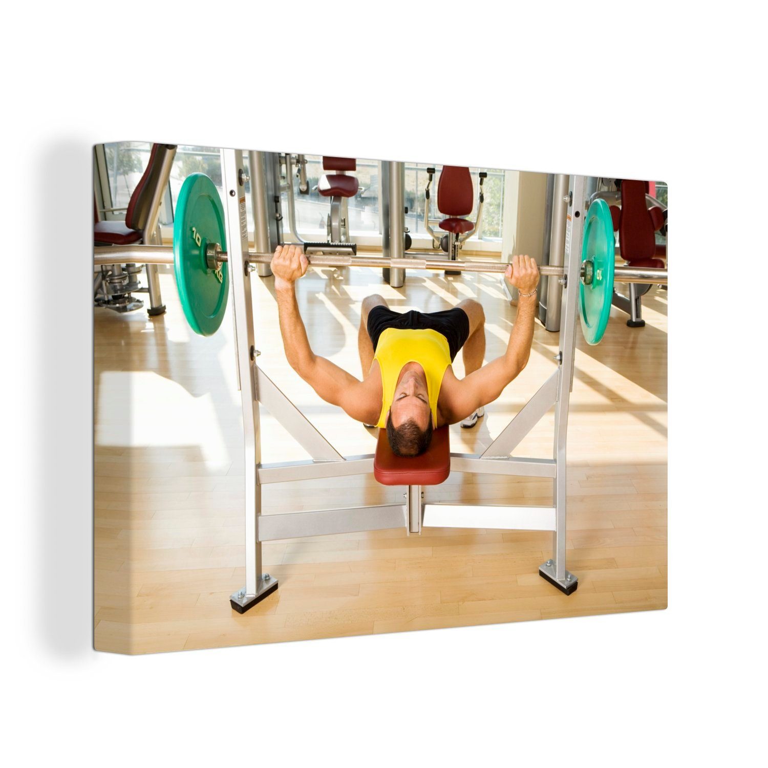 OneMillionCanvasses® Leinwandbild Ein Mann drückt im Fitnessstudio die Bank, (1 St), Wandbild Leinwandbilder, Aufhängefertig, Wanddeko, 30x20 cm