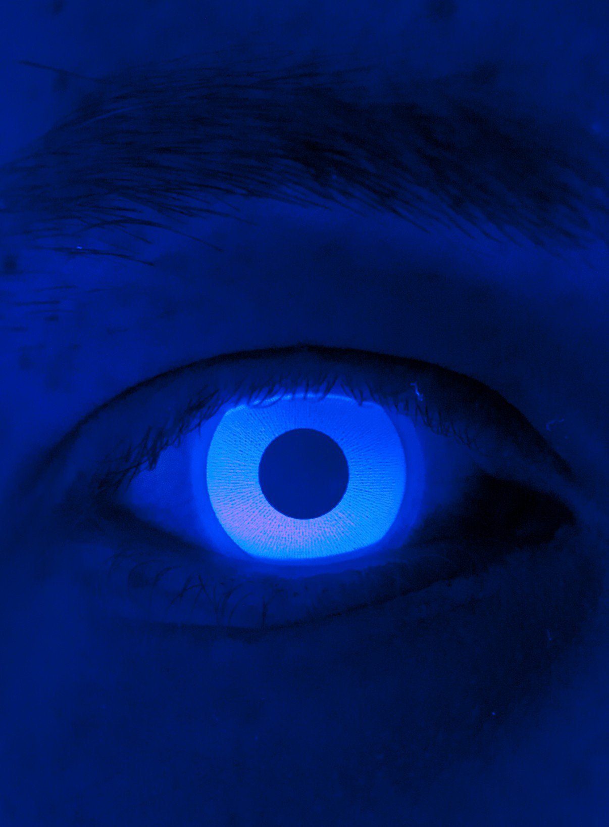 Maskworld Motivlinsen Glow Jahreslinsen Blaue UV Party Kontaktlinsen, Motivlinsen ohne Sehstärke