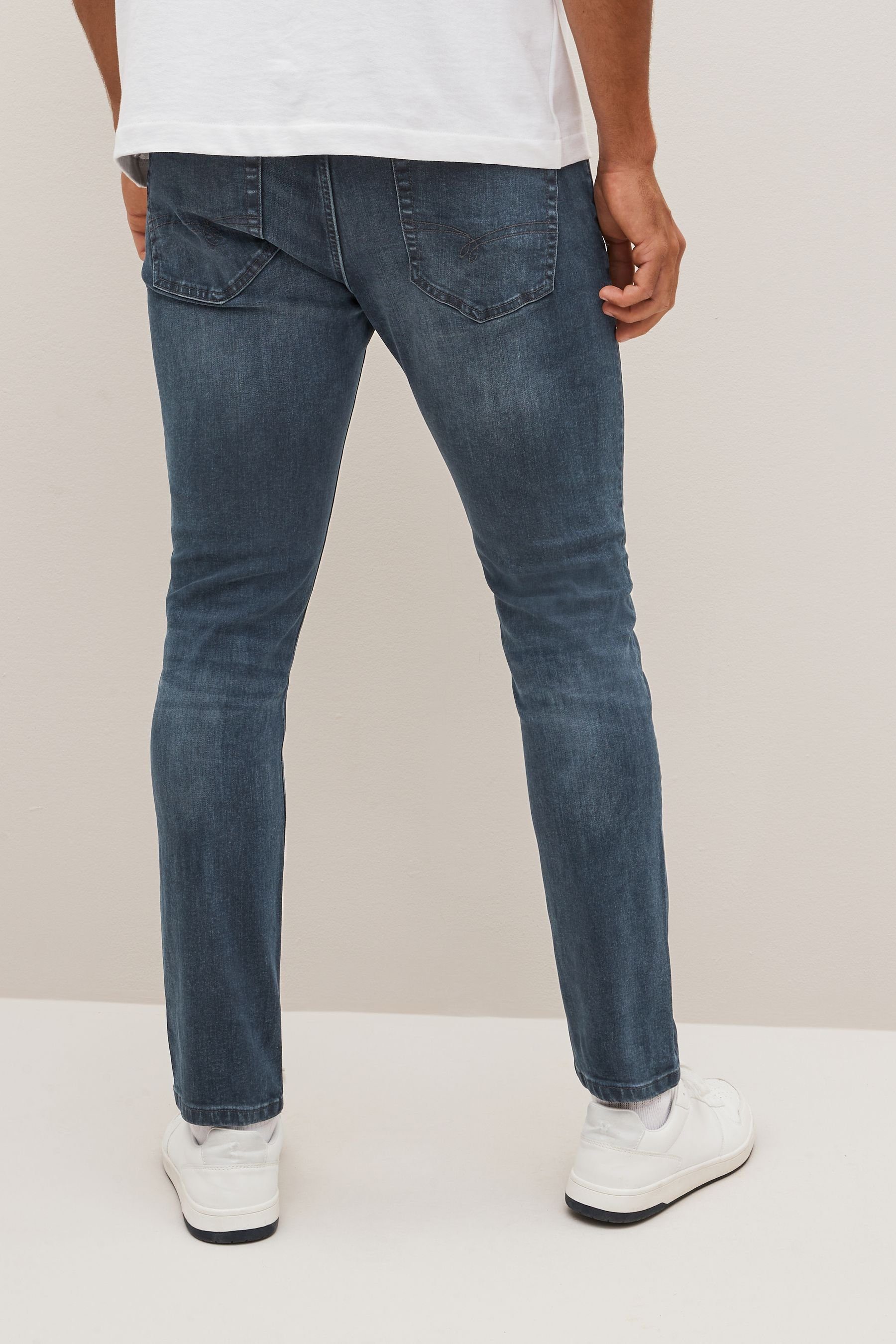 (1-tlg) Essential Jeans Navy Skinny-fit-Jeans Next Fit Skinny Stretch Smoky mit