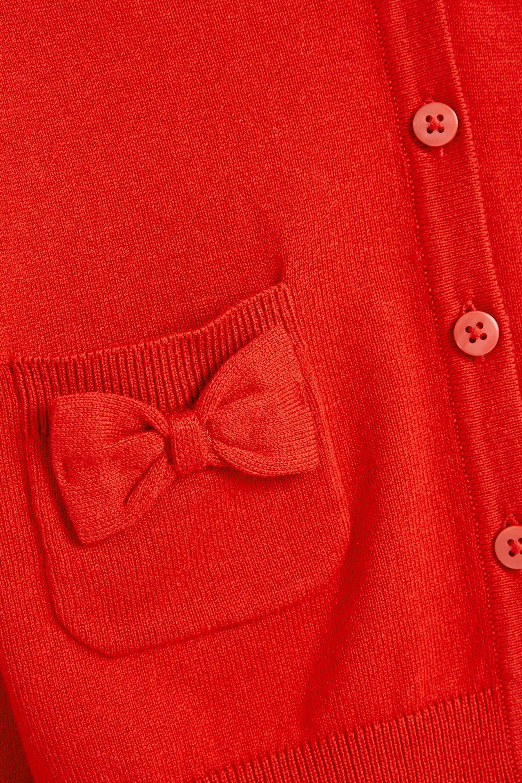 Strickjacke Taschen Strickjacke mit schleifenverzierten Next Red (1-tlg)