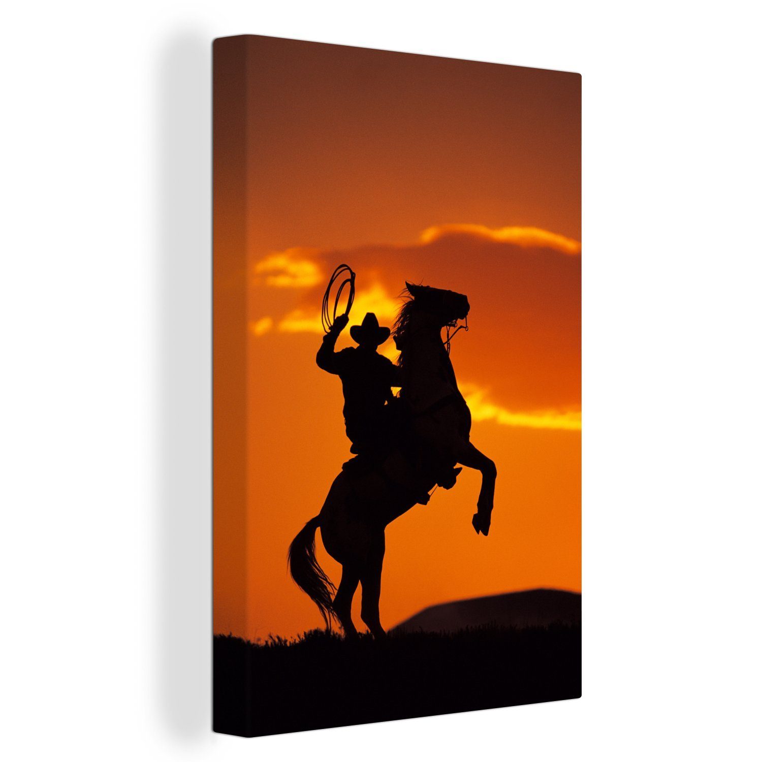 Silhouette fertig Leinwandbild Cowboys eines dem inkl. bespannt St), Leinwandbild auf OneMillionCanvasses® Pferderücken, Zackenaufhänger, tänzelt, 20x30 cm (1 Gemälde, der