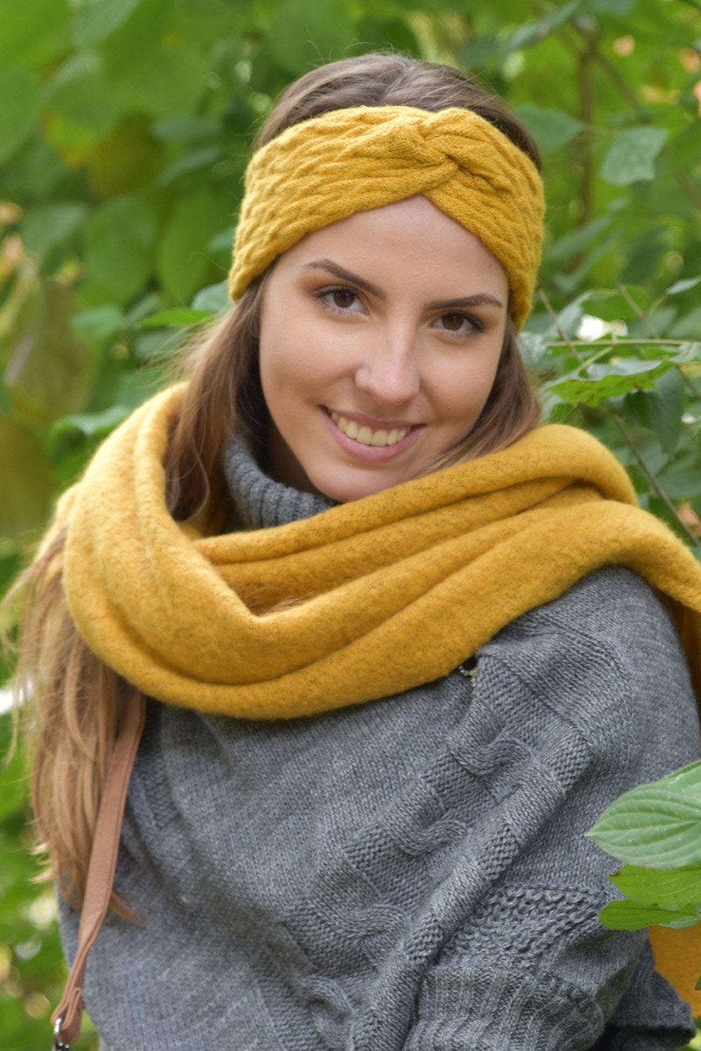styleBREAKER Stirnband Strick Stirnband mit Zopfmuster und Twist Knoten (1-St)