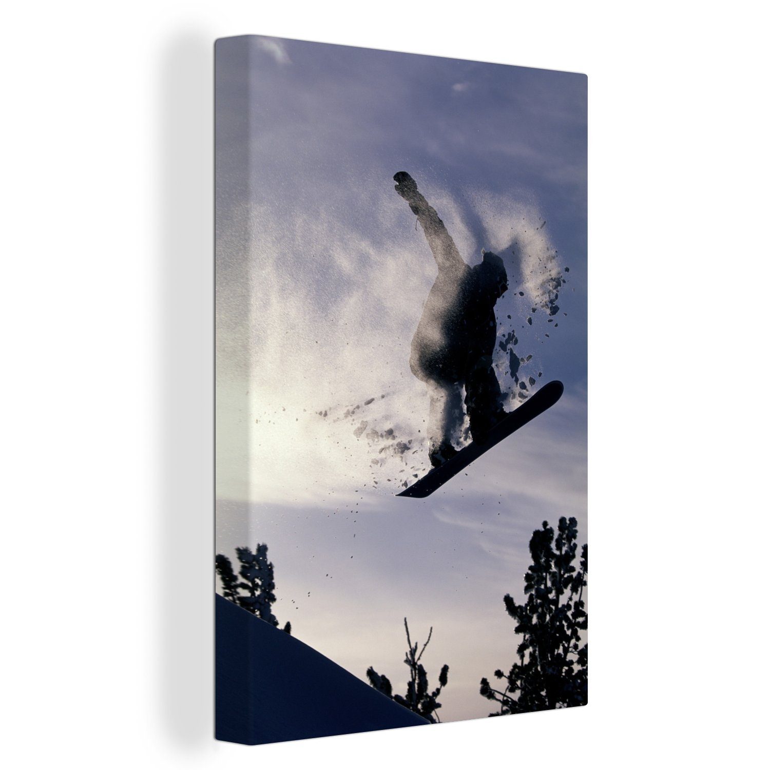 OneMillionCanvasses® Leinwandbild Ein Snowboarder hängt in der Luft und nimmt den Schnee mit, (1 St), Leinwandbild fertig bespannt inkl. Zackenaufhänger, Gemälde, 20x30 cm