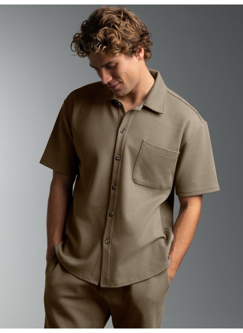 Trigema Blusenshirt TRIGEMA Polohemd in Waffel-Optik (1-tlg)