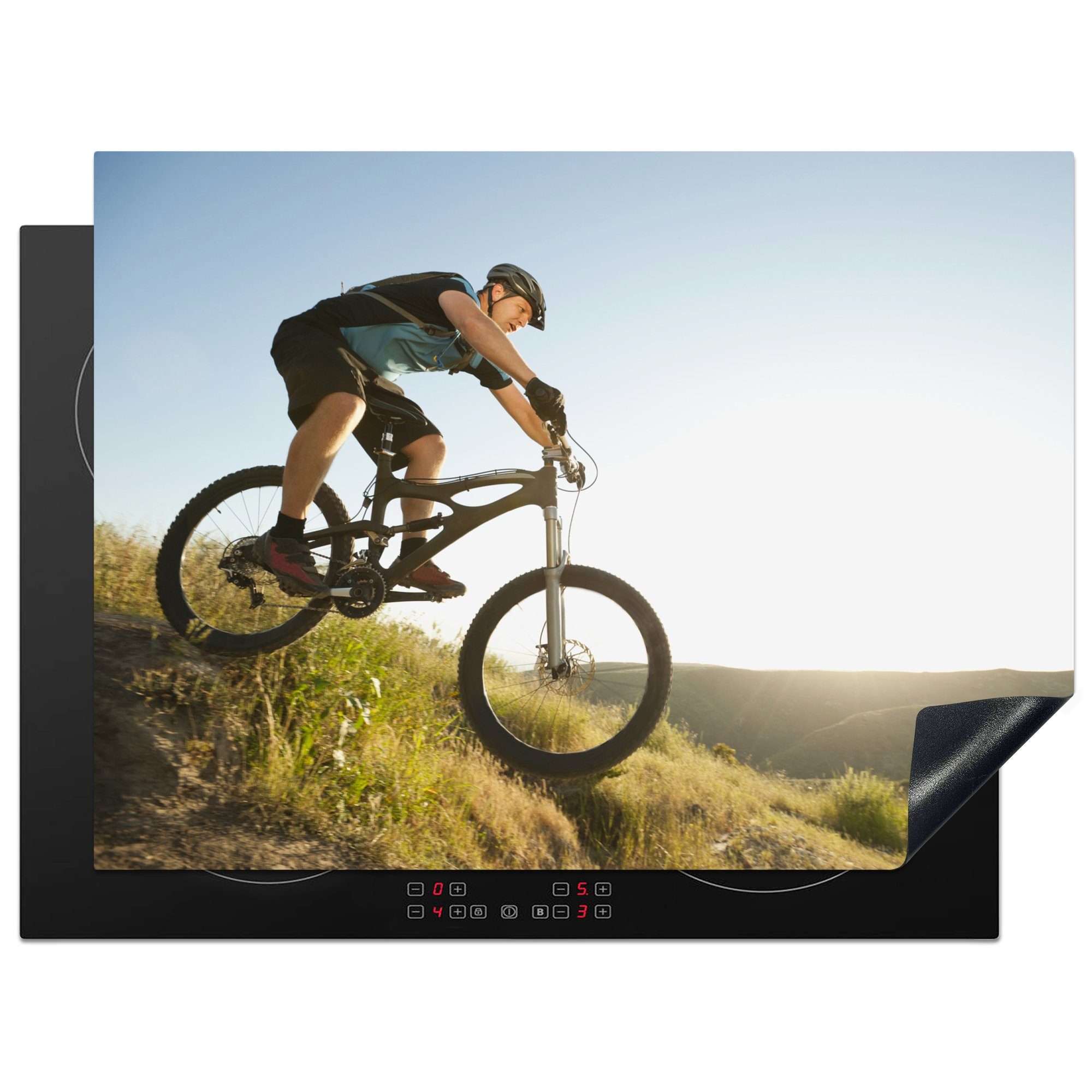 MuchoWow Herdblende-/Abdeckplatte Mann steigt auf einem Mountainbike ab, Vinyl, (1 tlg), 70x52 cm, Mobile Arbeitsfläche nutzbar, Ceranfeldabdeckung
