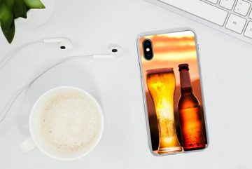 MuchoWow Handyhülle Bier bei Sonnenuntergang vor einer Bergkulisse, Handyhülle Apple iPhone Xs, Smartphone-Bumper, Print, Handy