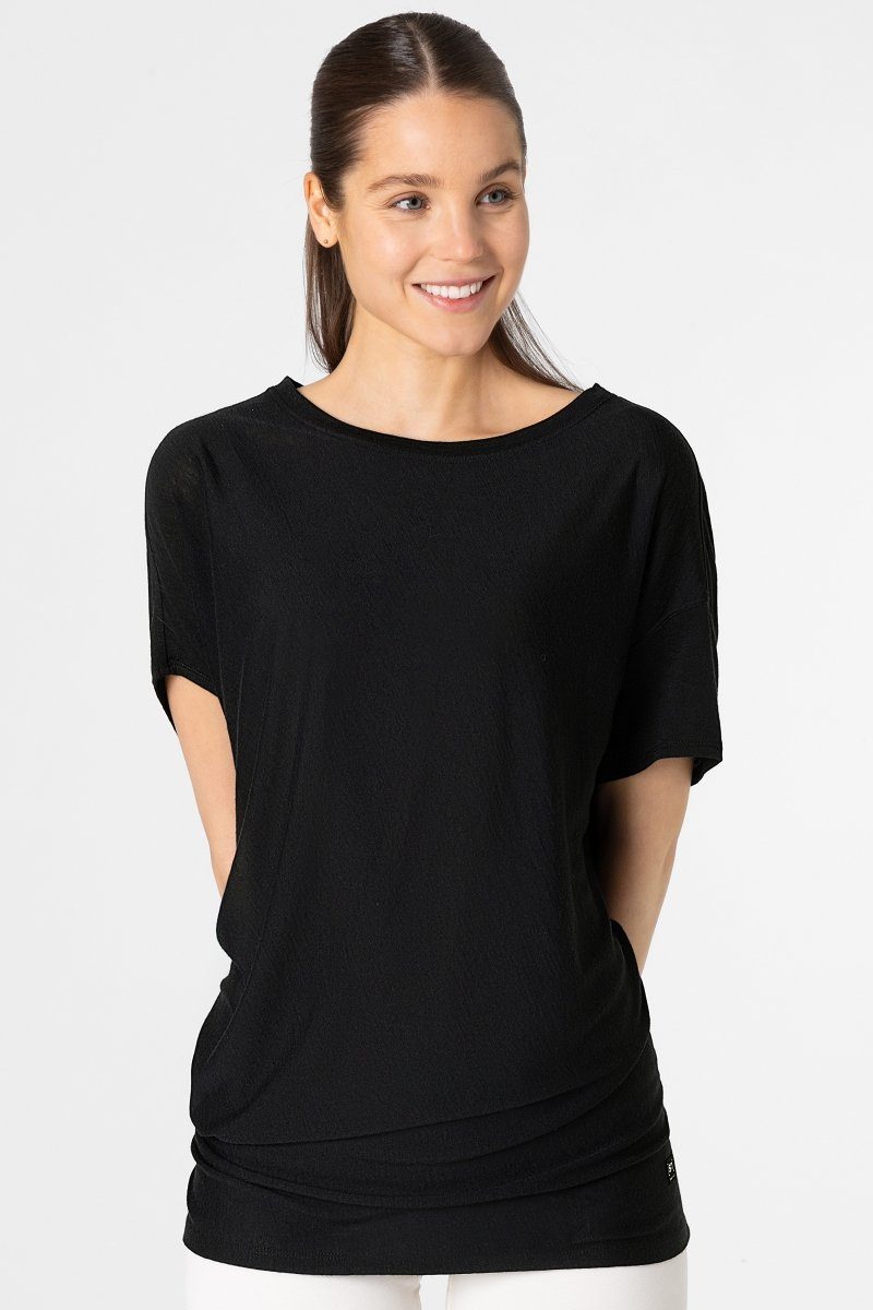 SUPER.NATURAL T-Shirt Merino T-Shirt W YOGA LOOSE TEE bequemer Merino-Materialmix Jet Black