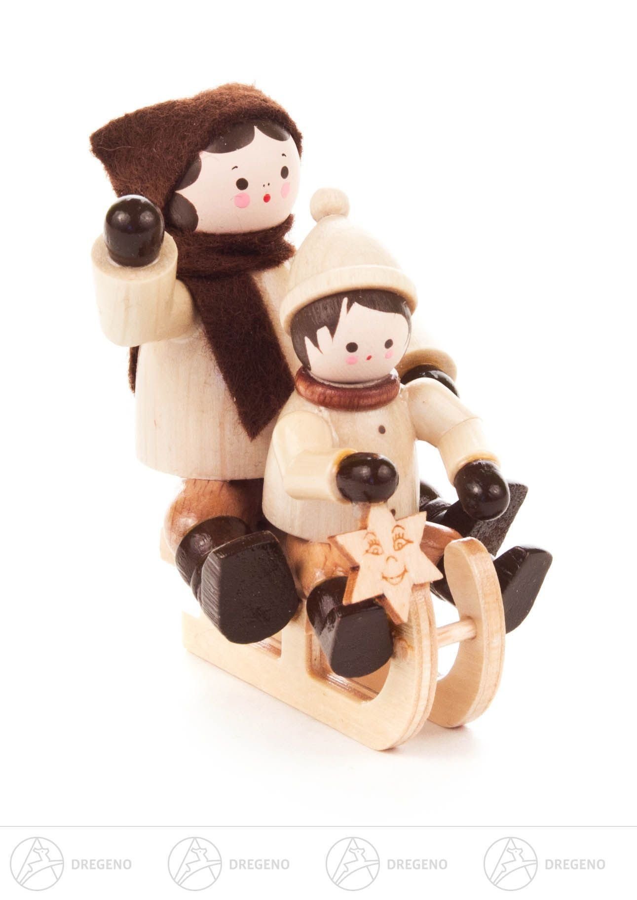 Dregeno Erzgebirge Weihnachtsfigur Miniatur Schlittenfahrerin mit Kind, natur Höhe ca 5,5 cm NEU