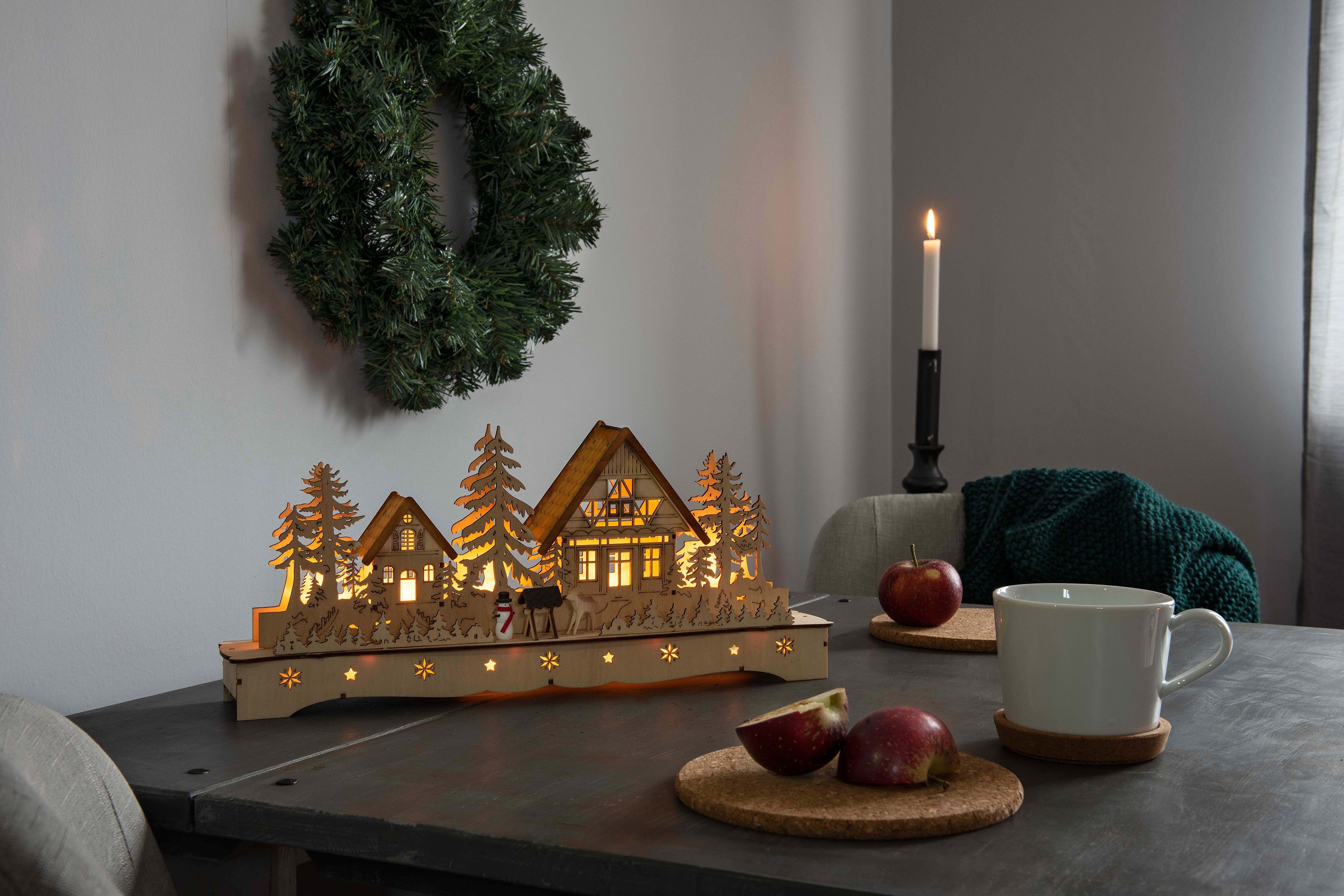 KONSTSMIDE Weihnachtsdorf Weihnachtsdeko, LED Holzsilhouette, mit Rentier Dorf Schneemann und