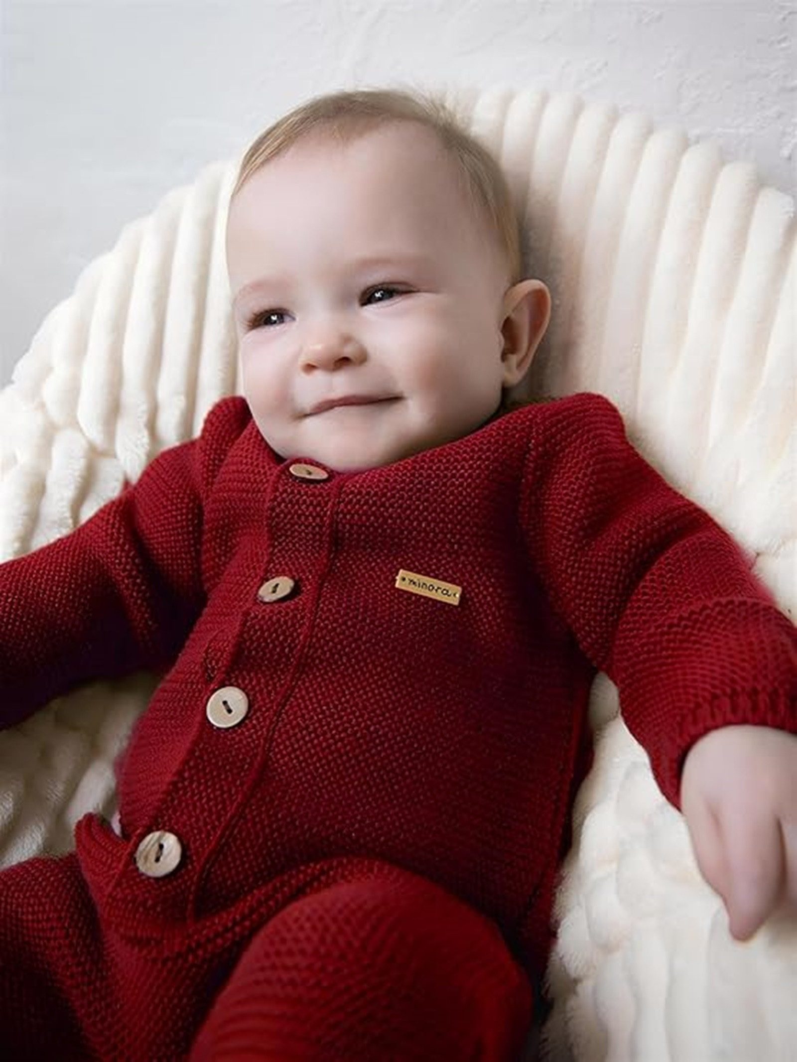 Minora Strickkleid Minora Gestrickter Unisex Strampler